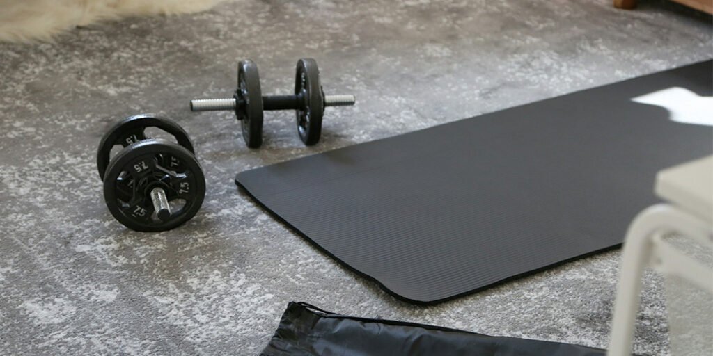 yoga mat with dumbbells carpet flooring