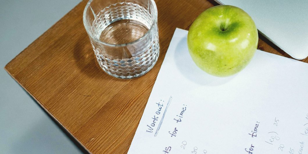 Home workout plan written in a notebook