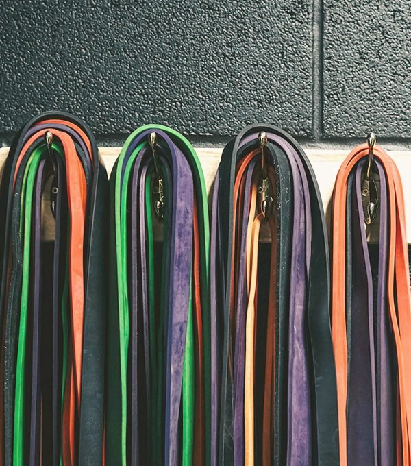 vertical storage in a compact home gym setup